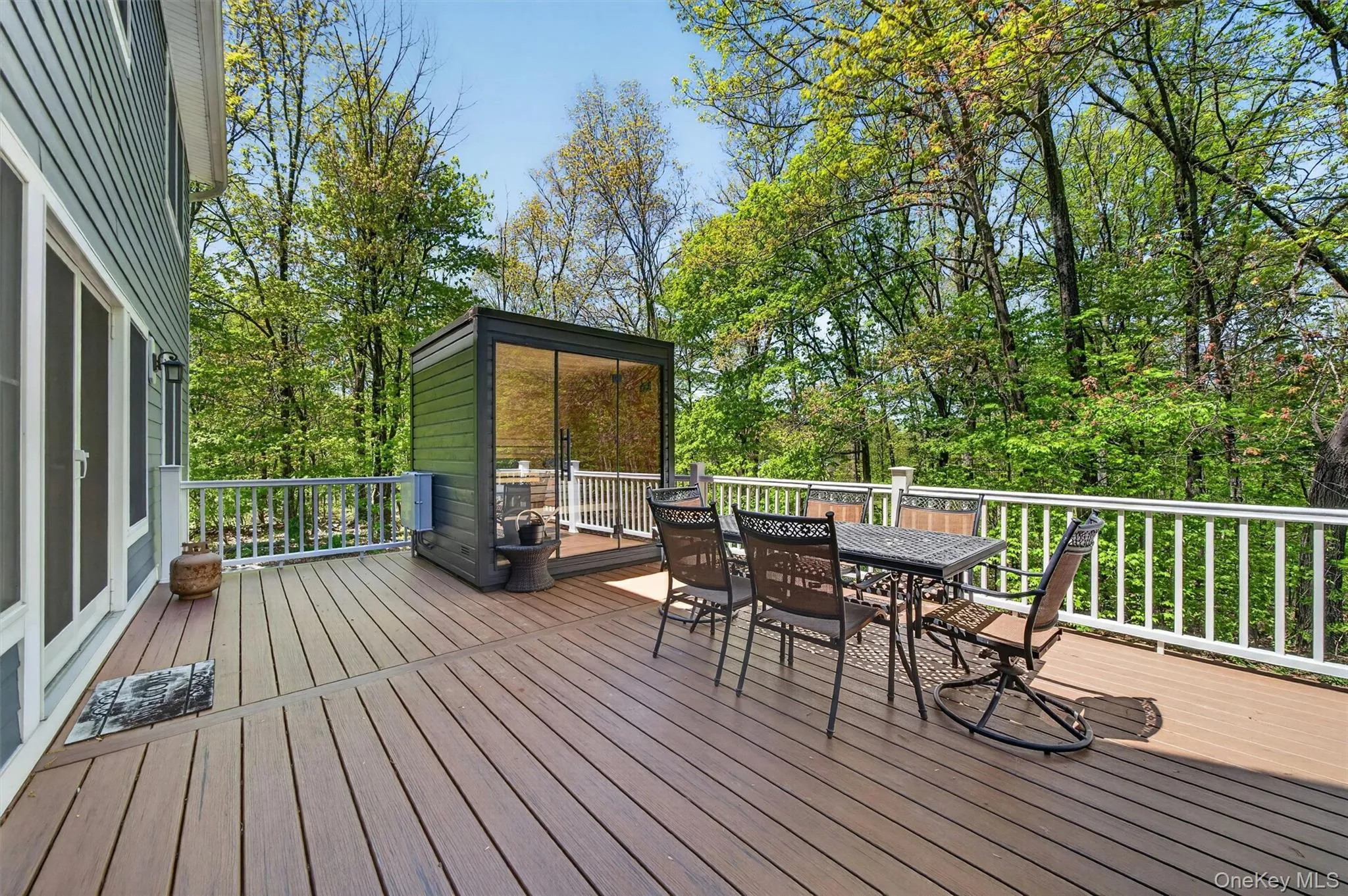 The expansive rear deck serves as a private sanctuary, complete with a premium outdoor sauna, offering the ultimate spot to unwind after a swim. The expansive rear deck serves as a private sanctuary, complete with a premium outdoor sauna, offering the ultimate spot to unwind after a swim.