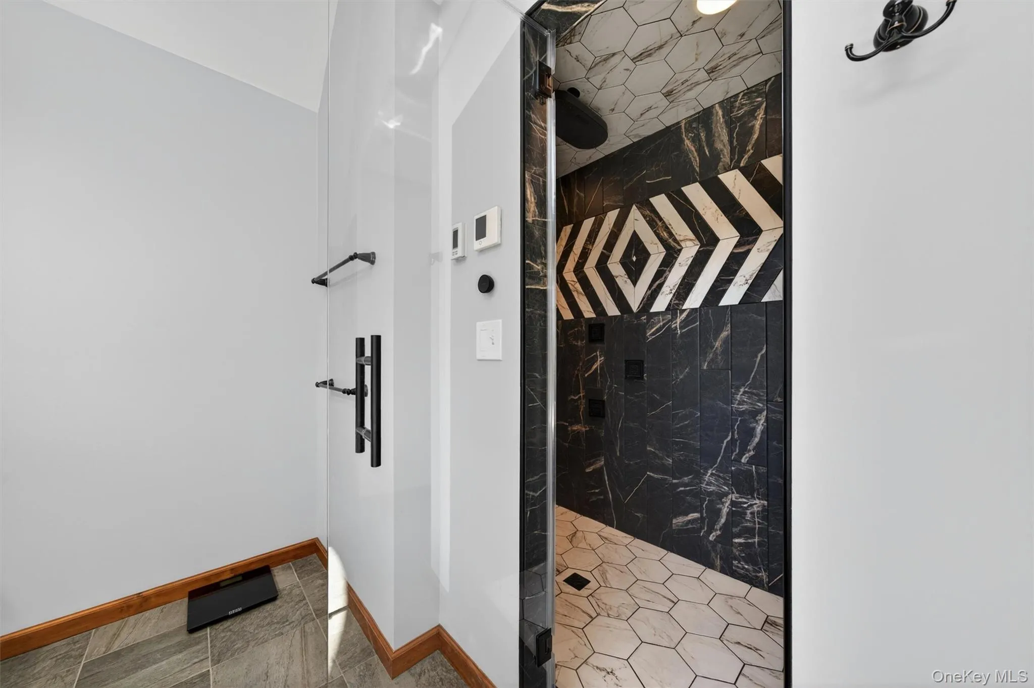 Recently renovated, the bathroom showcases a distinctive oversized tiled walk-in steam shower for a luxurious spa-inspired experience. Recently renovated, the bathroom showcases a distinctive oversized tiled walk-in steam shower for a luxurious spa-inspired experience.