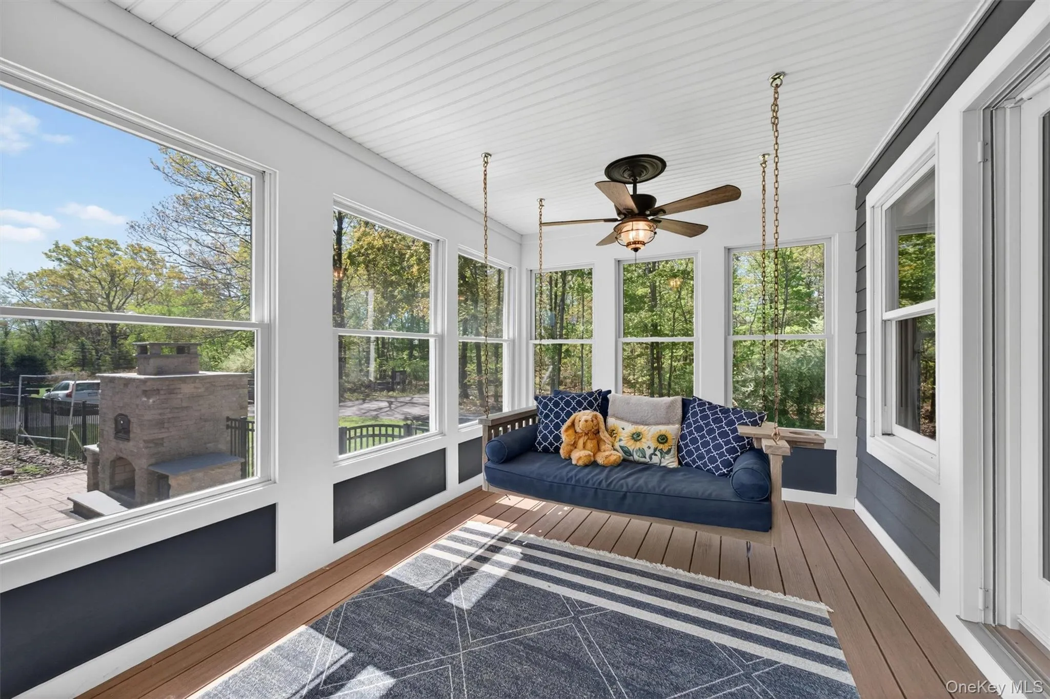 The covered porch extends the season of outdoor fun and is the perfect perch from which to observe all the activity on the pool deck! The covered porch extends the season of outdoor fun and is the perfect perch from which to observe all the activity on the pool deck!