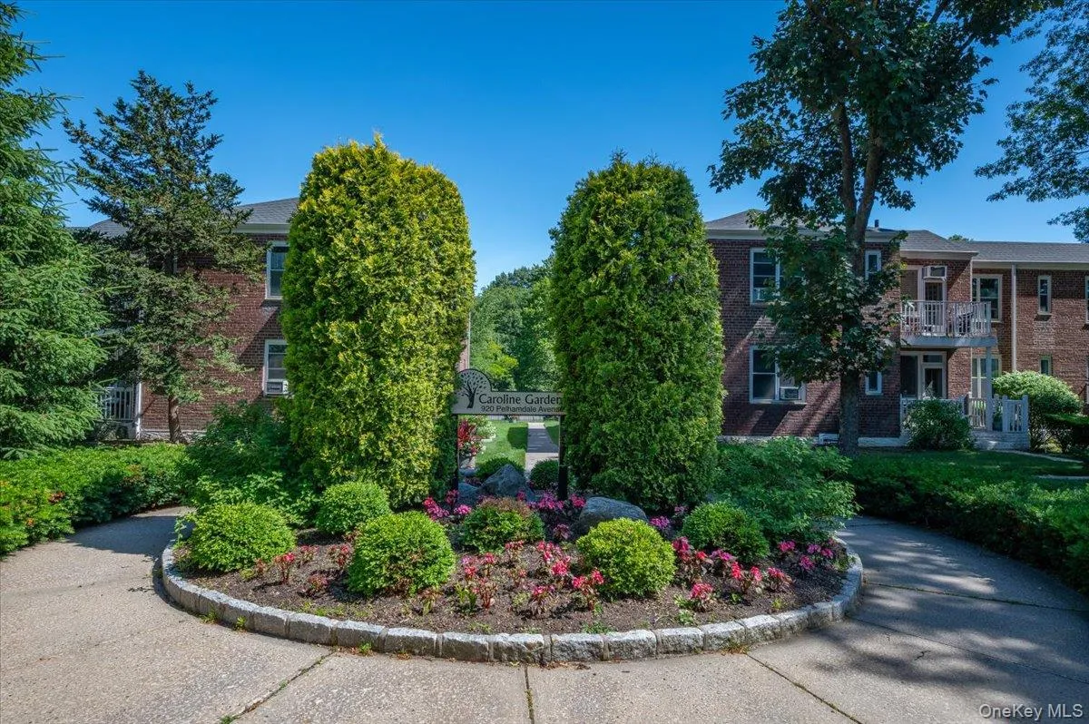 Caroline Gardens has 4 garden style apartment buildings. The entrance is framed by lush flowering landscaping for a welcoming first impression. Caroline Gardens has 4 garden style apartment buildings. The entrance is framed by lush flowering landscaping for a welcoming first impression.