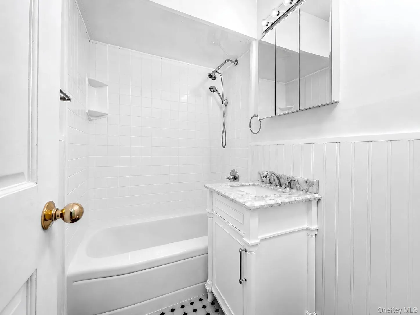 Classic full hall Bathbath includes a tub-shower combination, marble topped vanity, & medicine cabinet. Classic full hall Bathbath includes a tub-shower combination, marble topped vanity, & medicine cabinet.