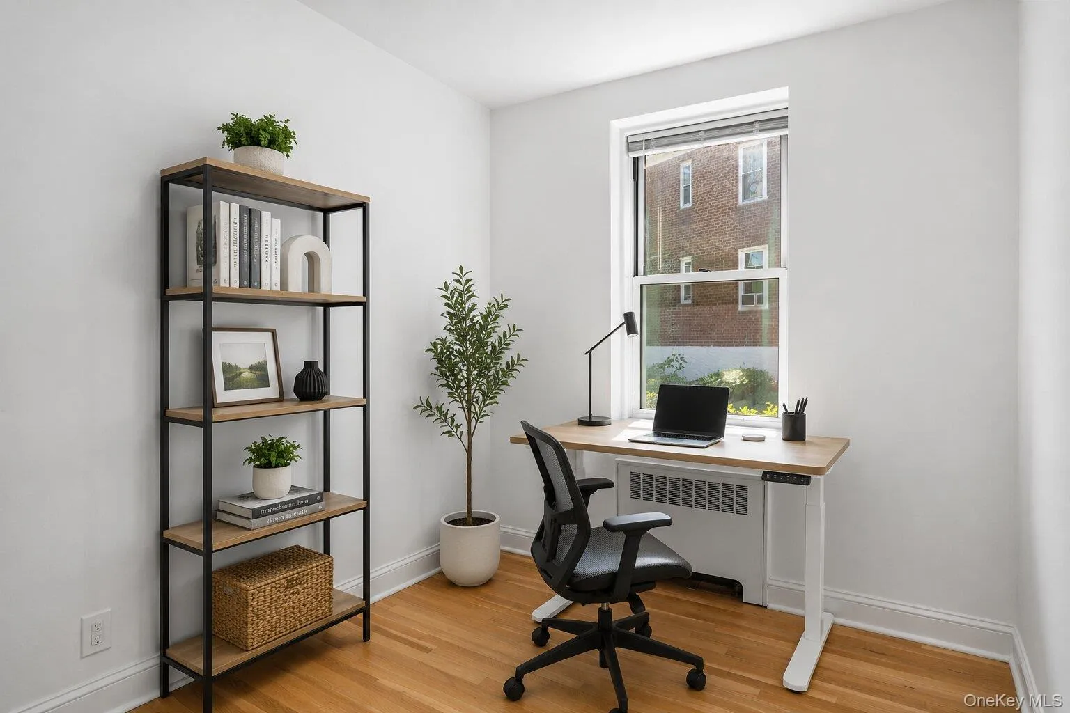 Virtually staged BONUS room with hardwood floors and a large window, ideal as a home office, den, or dining area. Virtually staged BONUS room with hardwood floors and a large window, ideal as a home office, den, or dining area.