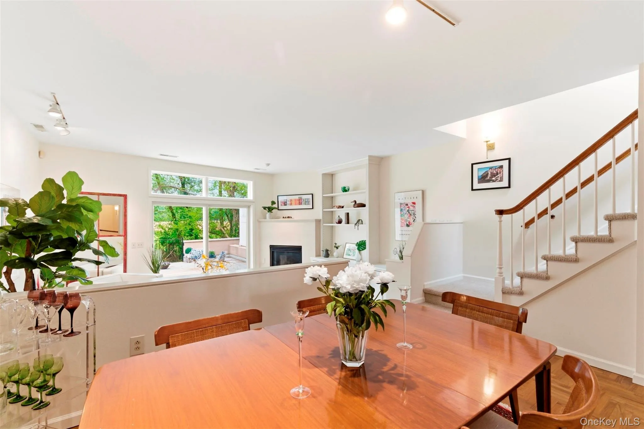Open-concept dining-living room with high ceilings. Open-concept dining-living room with high ceilings.