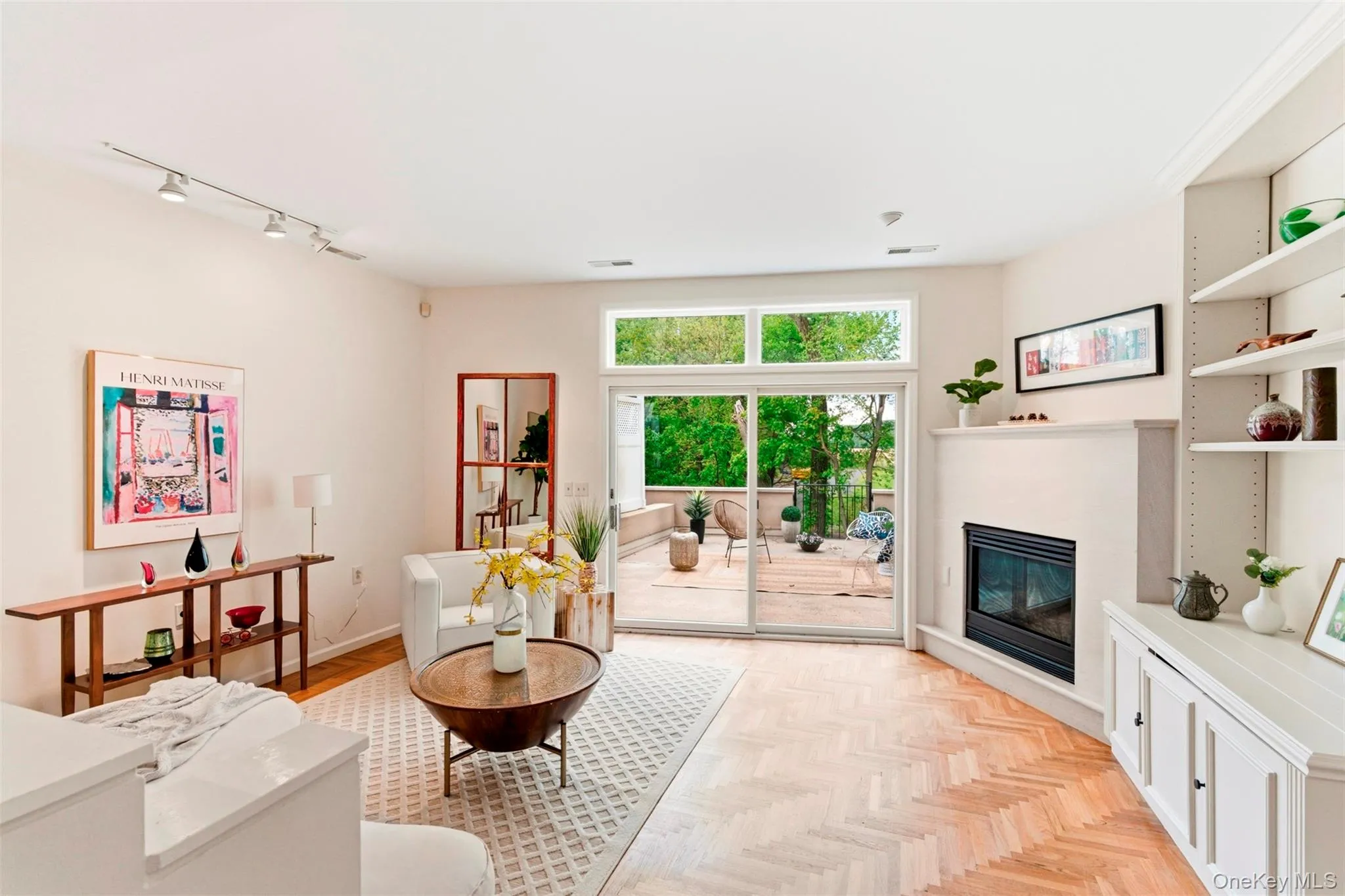 Sunny, open-concept living room with deck access. Sunny, open-concept living room with deck access.