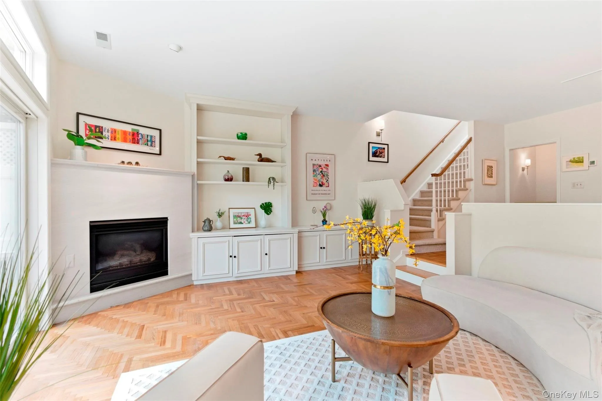 Fireplace and custom built-in cabinetry. Fireplace and custom built-in cabinetry.