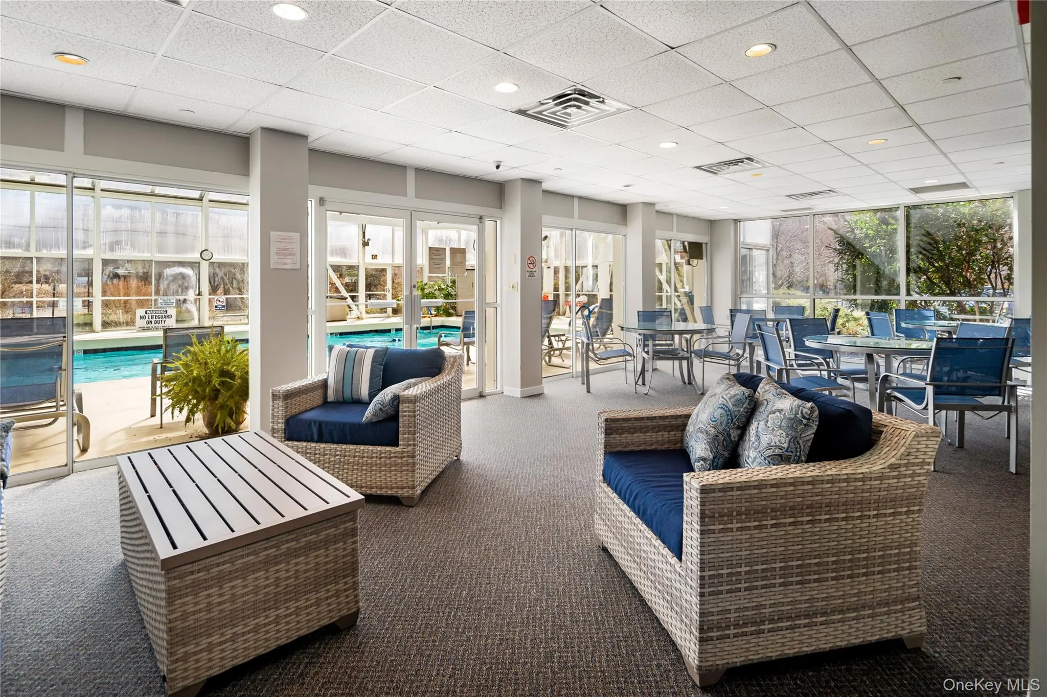 Community seating area next to the pool. Community seating area next to the pool.
