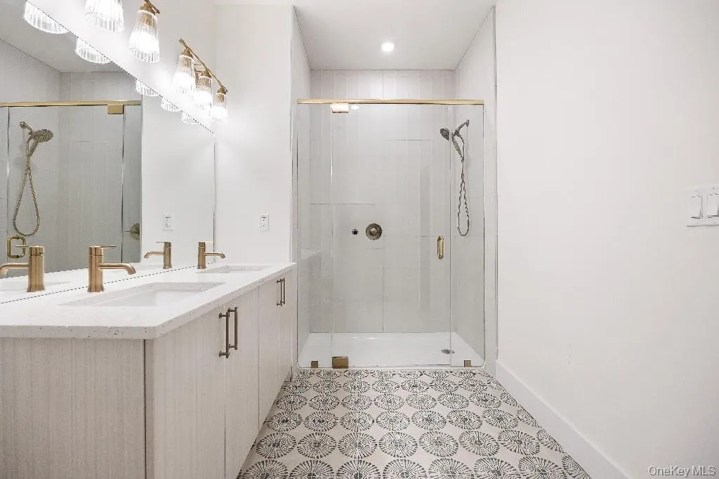 Bathroom with vanity and a shower with shower door Bathroom with vanity and a shower with shower door