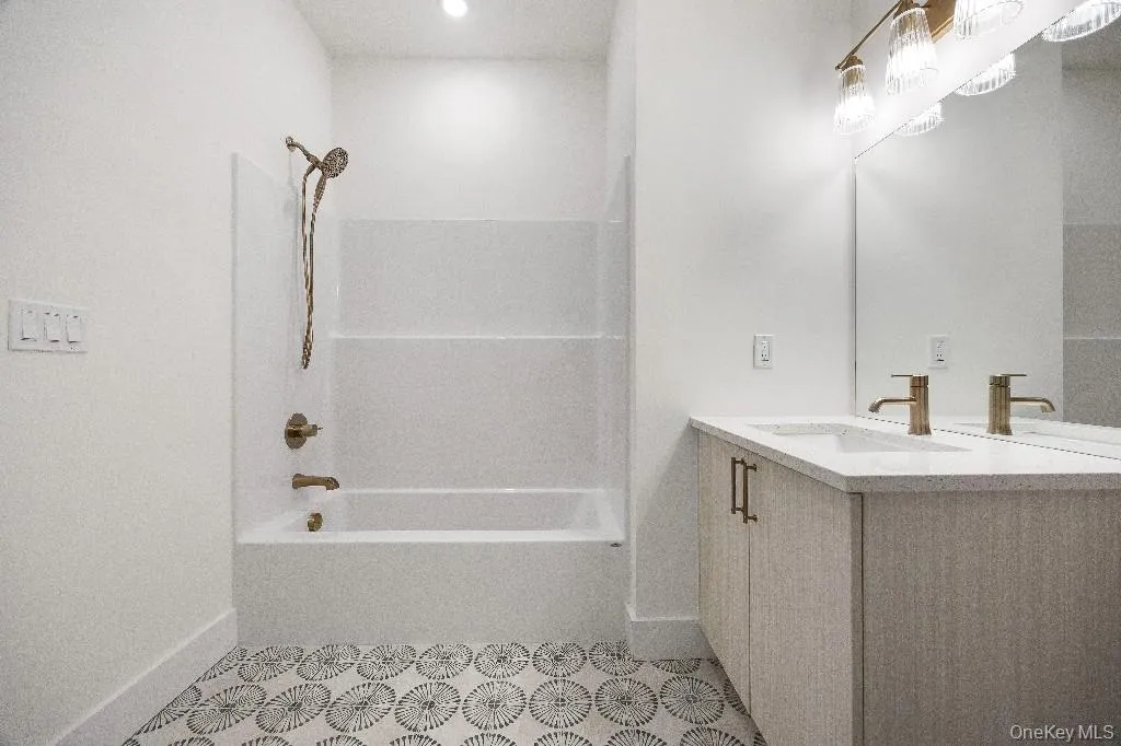 Bathroom with vanity and shower / bathtub combination Bathroom with vanity and shower / bathtub combination