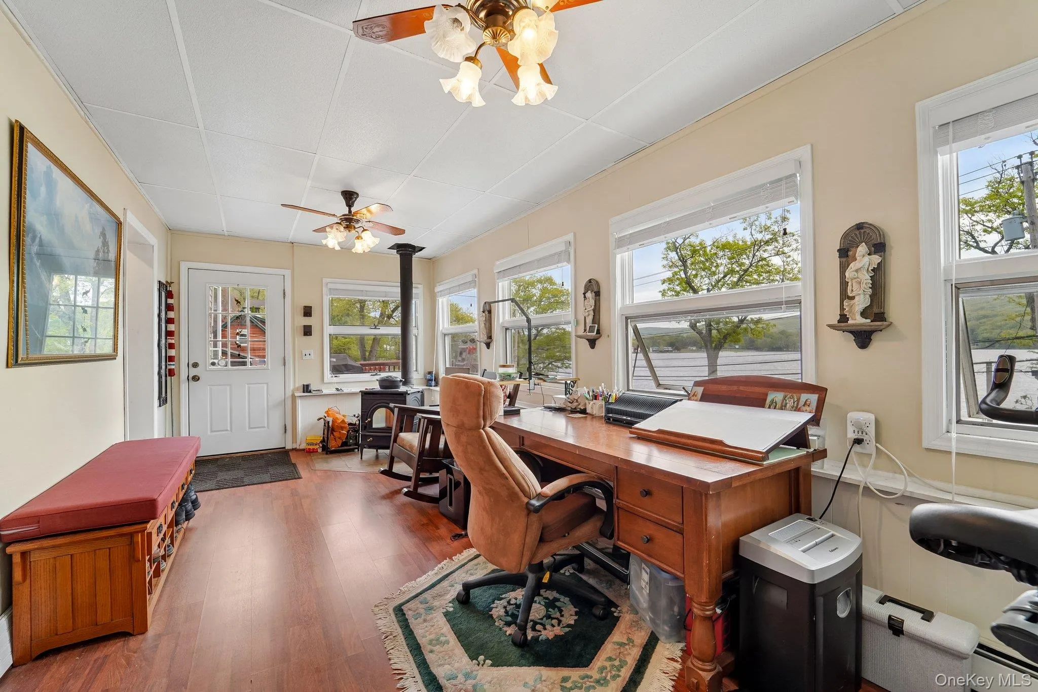 Entry way into large enclosed porch with lake views. Entry way into large enclosed porch with lake views.