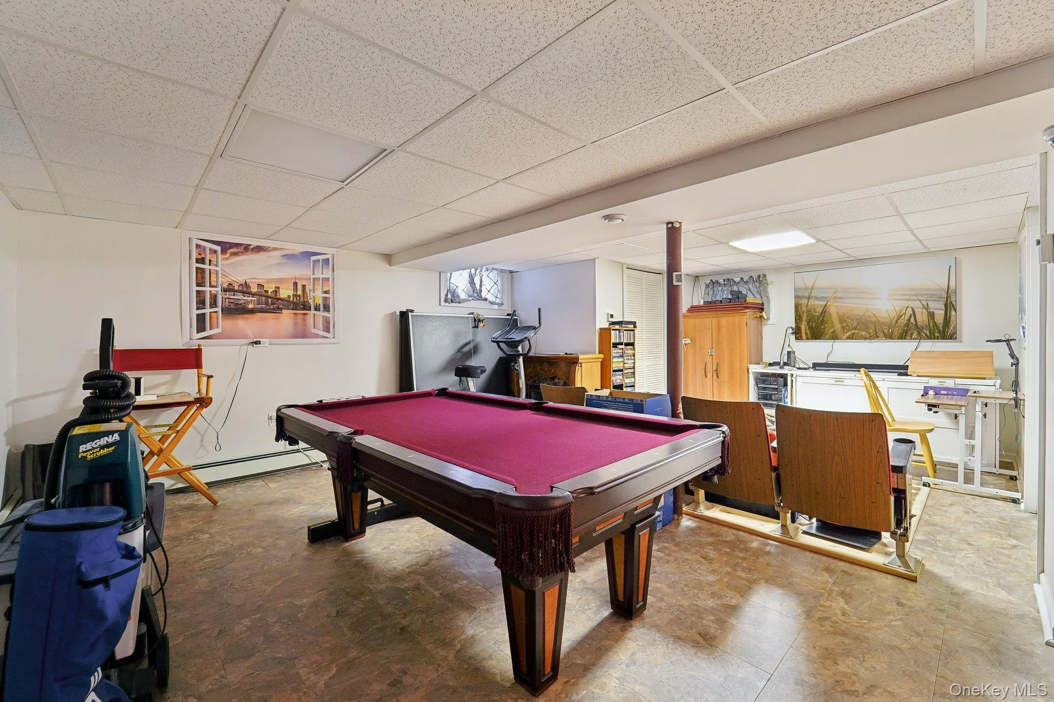 Pool table area in basement and area for watching movies. Pool table area in basement and area for watching movies.