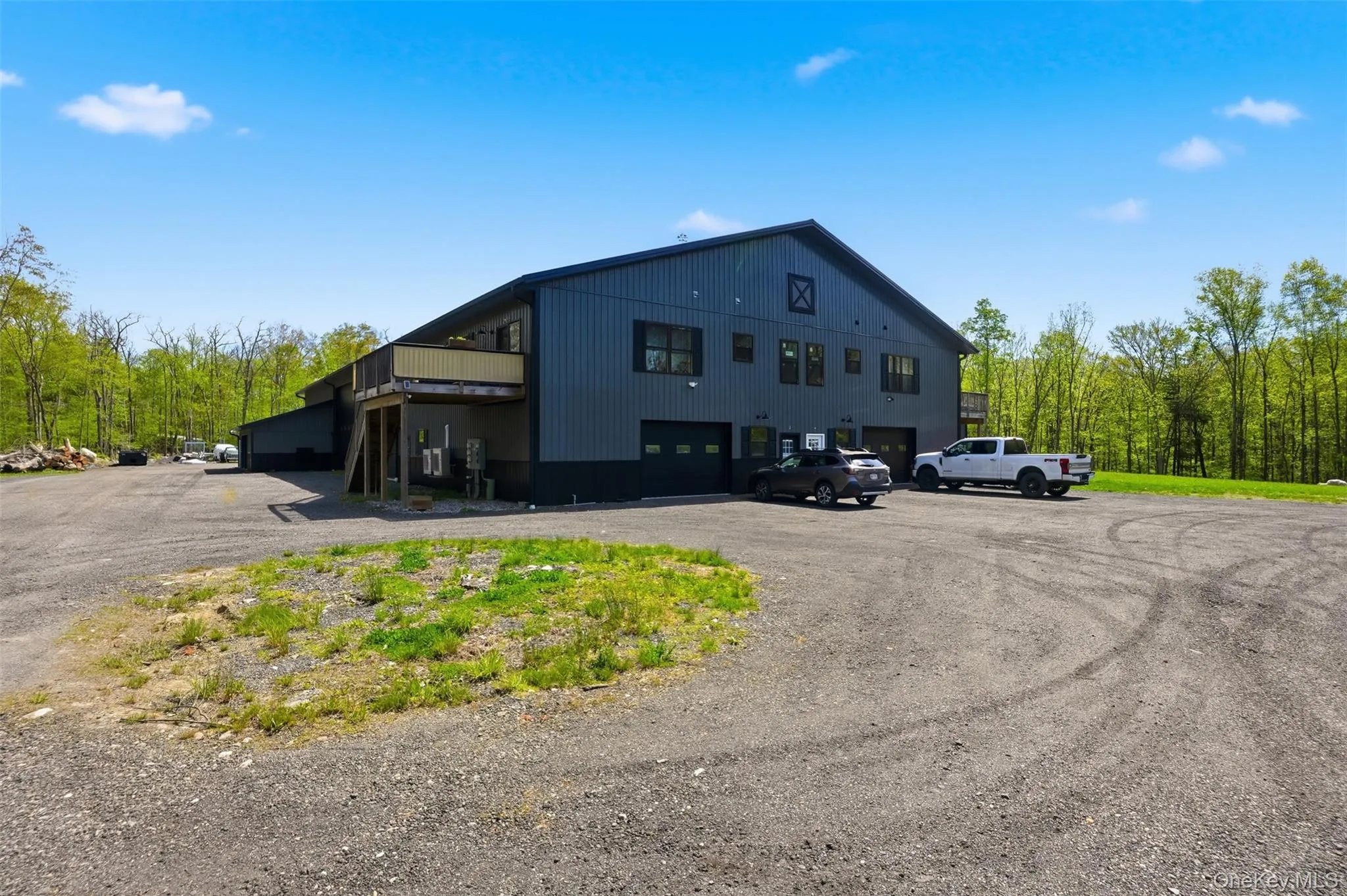 Upper level are two apartments each with their own deck and garage space. Upper level are two apartments each with their own deck and garage space.