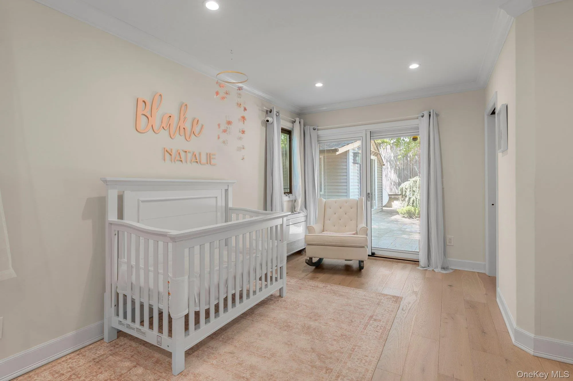 Light-toned wood-finish flooring extending throughout, recessed lighting, and crown molding Light-toned wood-finish flooring extending throughout, recessed lighting, and crown molding