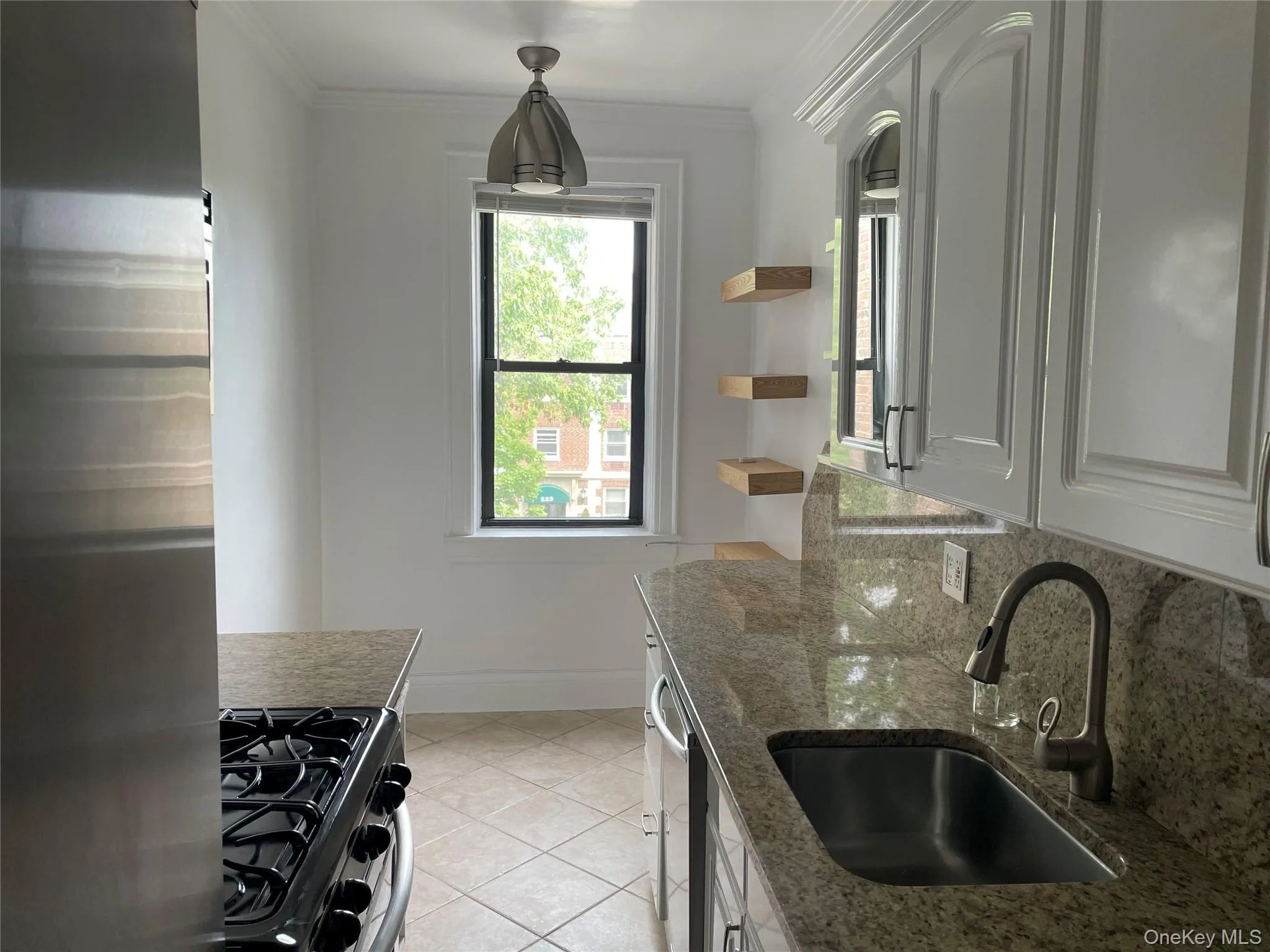 stainless appliances, granite countertops, room for a table and chairs area for a stool at the end of the counter stainless appliances, granite countertops, room for a table and chairs area for a stool at the end of the counter