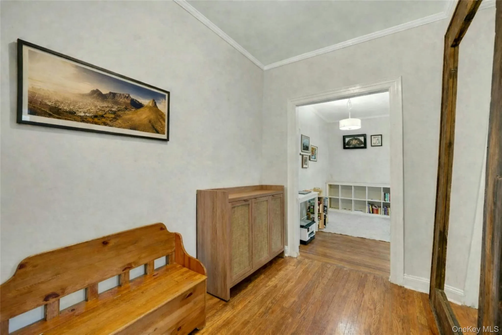 There is enough space in the foyer for bookcases and a desk. There is enough space in the foyer for bookcases and a desk.