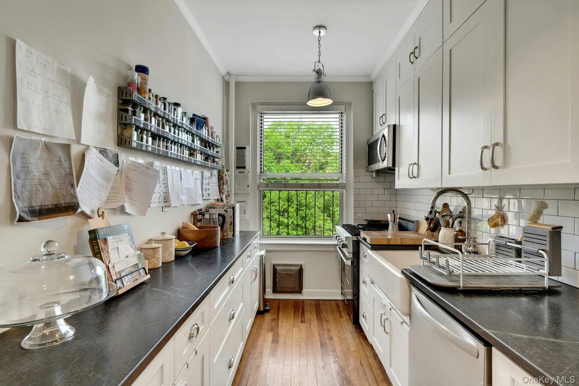 Notice the amount of work space and cabinet storage this well-lit kitchen offers. Notice the amount of work space and cabinet storage this well-lit kitchen offers.