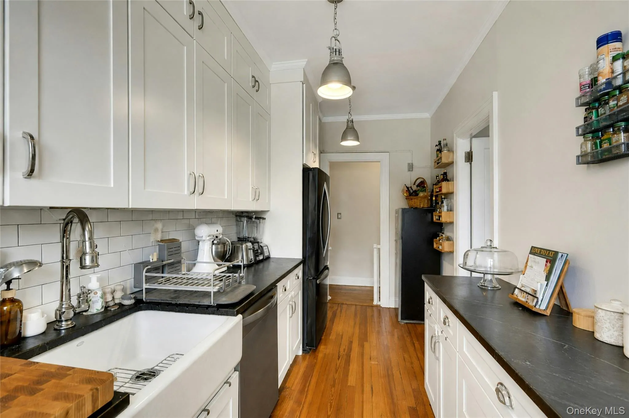 The kitchen has a practical and pretty farm sink and lovely solid wood floors. The kitchen has a practical and pretty farm sink and lovely solid wood floors.