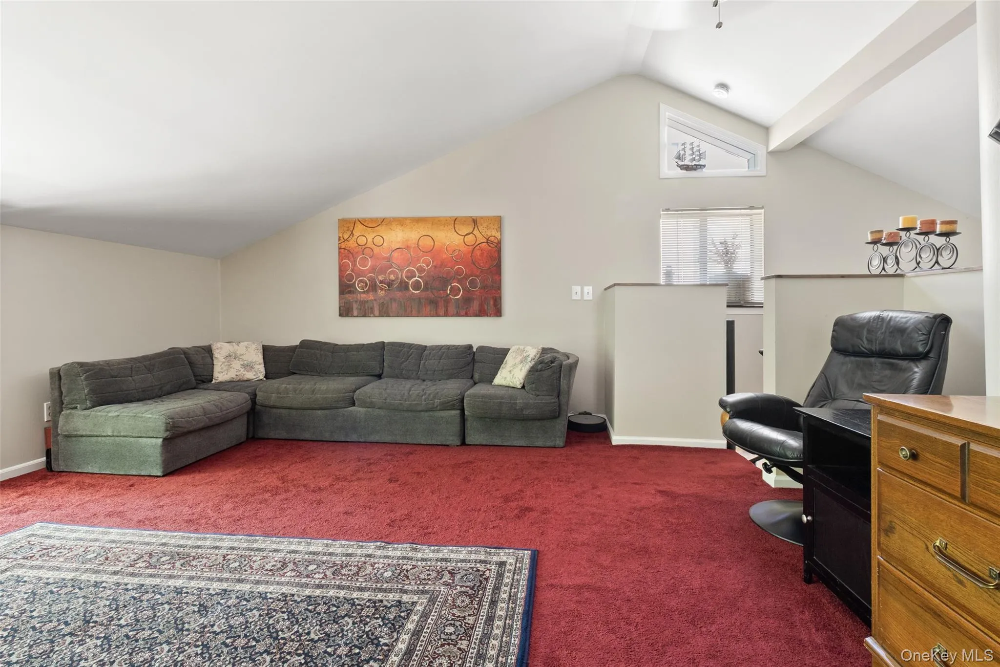 Bright and airy loft featuring peaceful views of the surrounding woods, offering valuable flexible living space with a calm, private feel. Bright and airy loft featuring peaceful views of the surrounding woods, offering valuable flexible living space with a calm, private feel.
