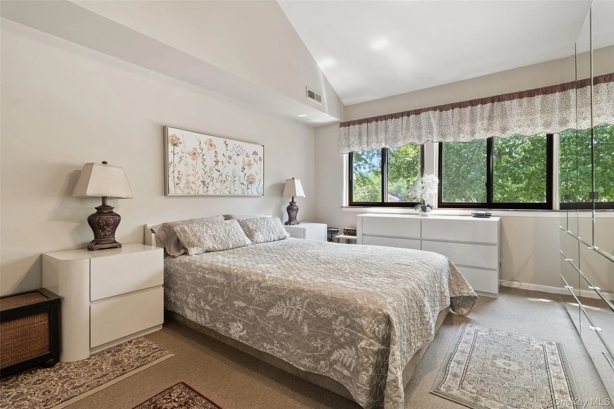 This bright, generously sized bedroom combines comfort and functionality with large closet space and expansive windows, The light-filled interior and lush outdoor outlook enhance its welcoming feel. This bright, generously sized bedroom combines comfort and functionality with large closet space and expansive windows, The light-filled interior and lush outdoor outlook enhance its welcoming feel.