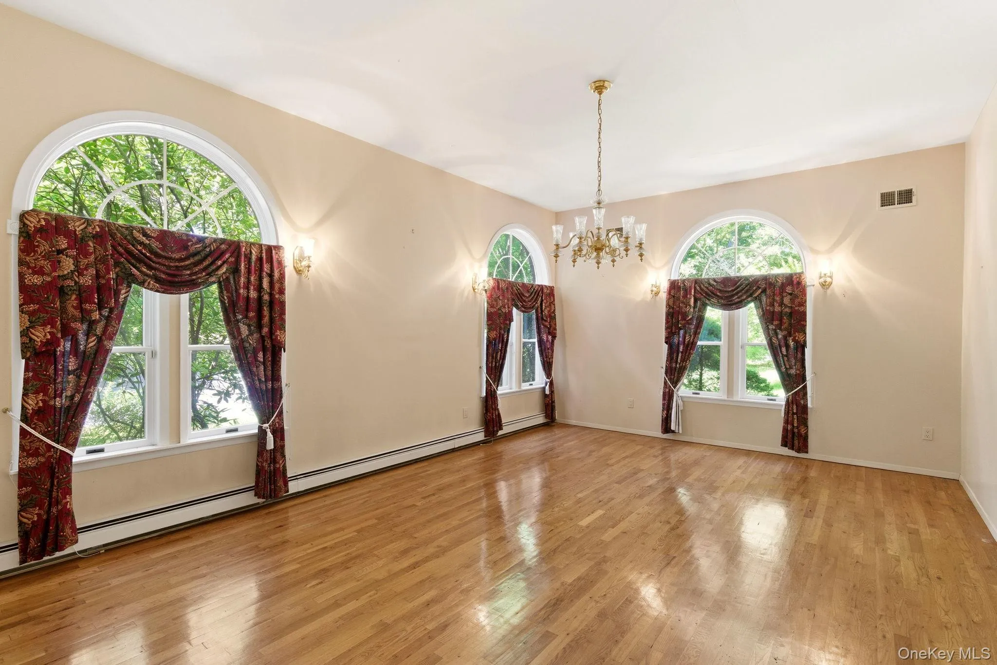 Formal Dining room with hardwood floors, and high ceilings Formal Dining room with hardwood floors, and high ceilings
