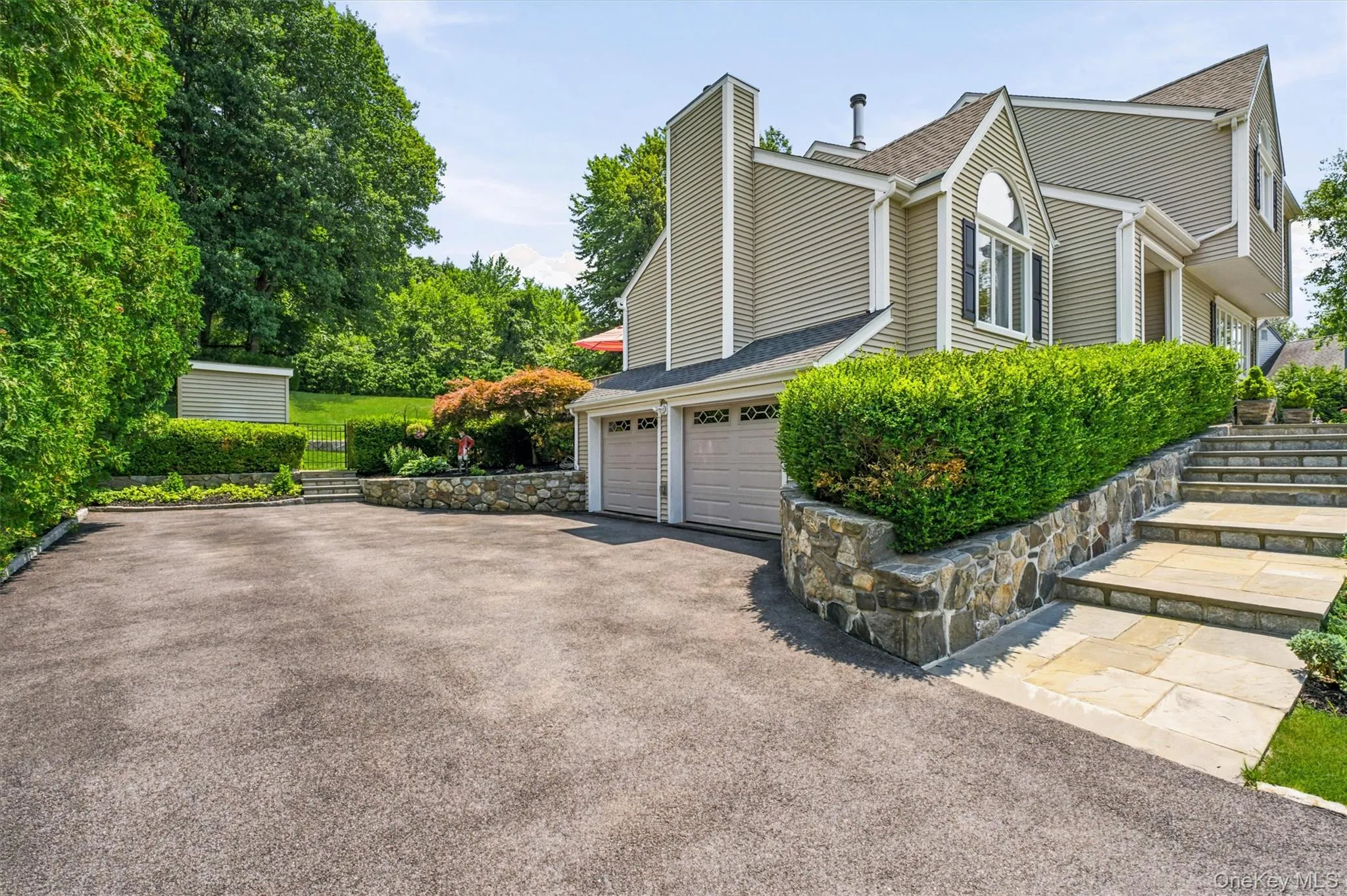 Elegant walk way to front door. Elegant walk way to front door.