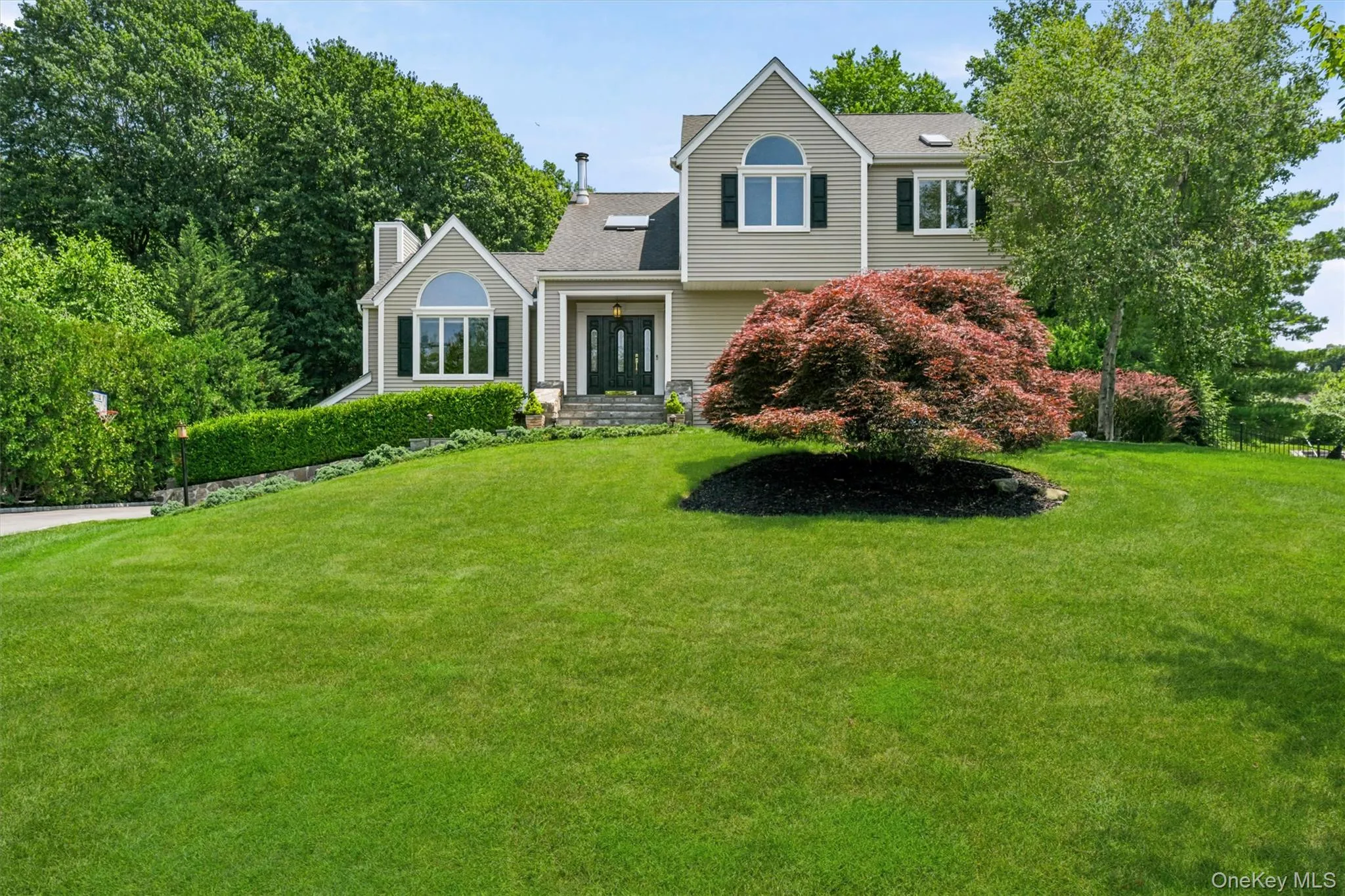 Gracious front yard with specimen trees and perennial plantings. Gracious front yard with specimen trees and perennial plantings.