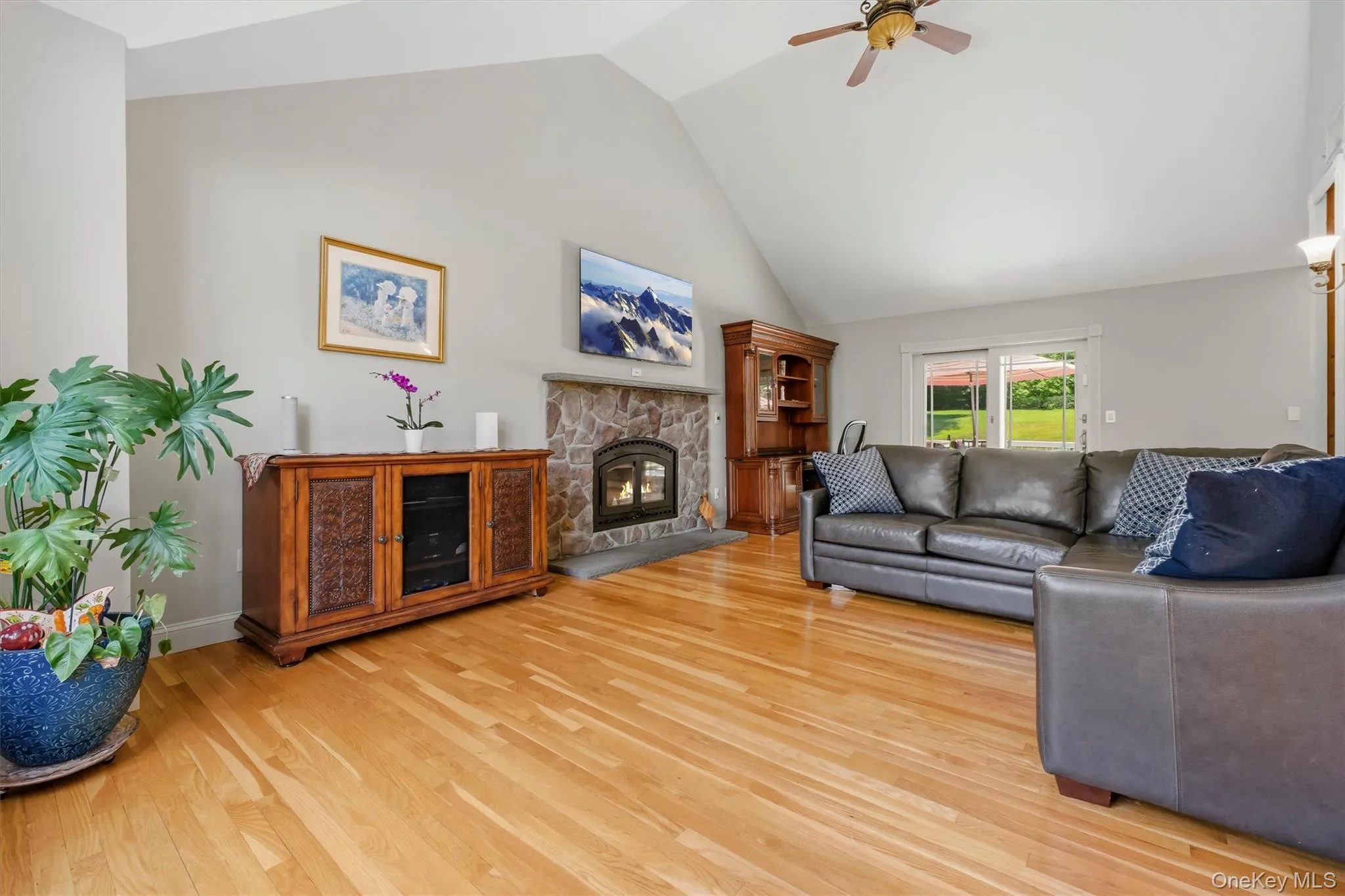 Another angle of great room with sliders to deck. Another angle of great room with sliders to deck.