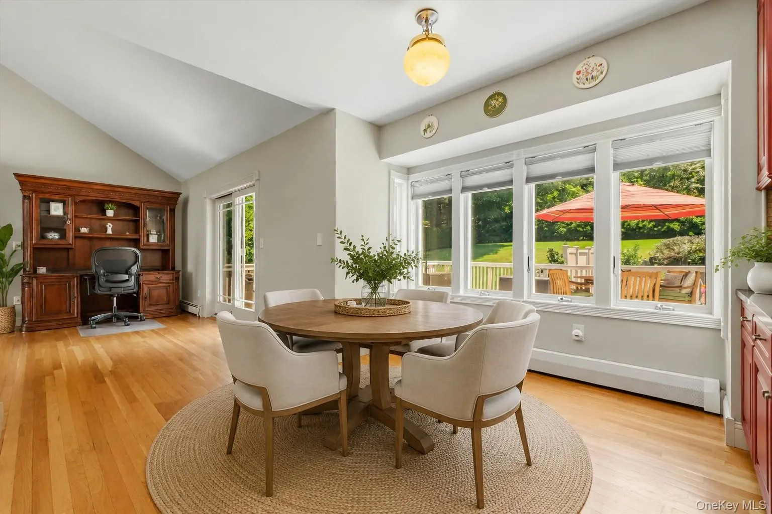 Virtually staged. table overlooking the back deck. Virtually staged. table overlooking the back deck.