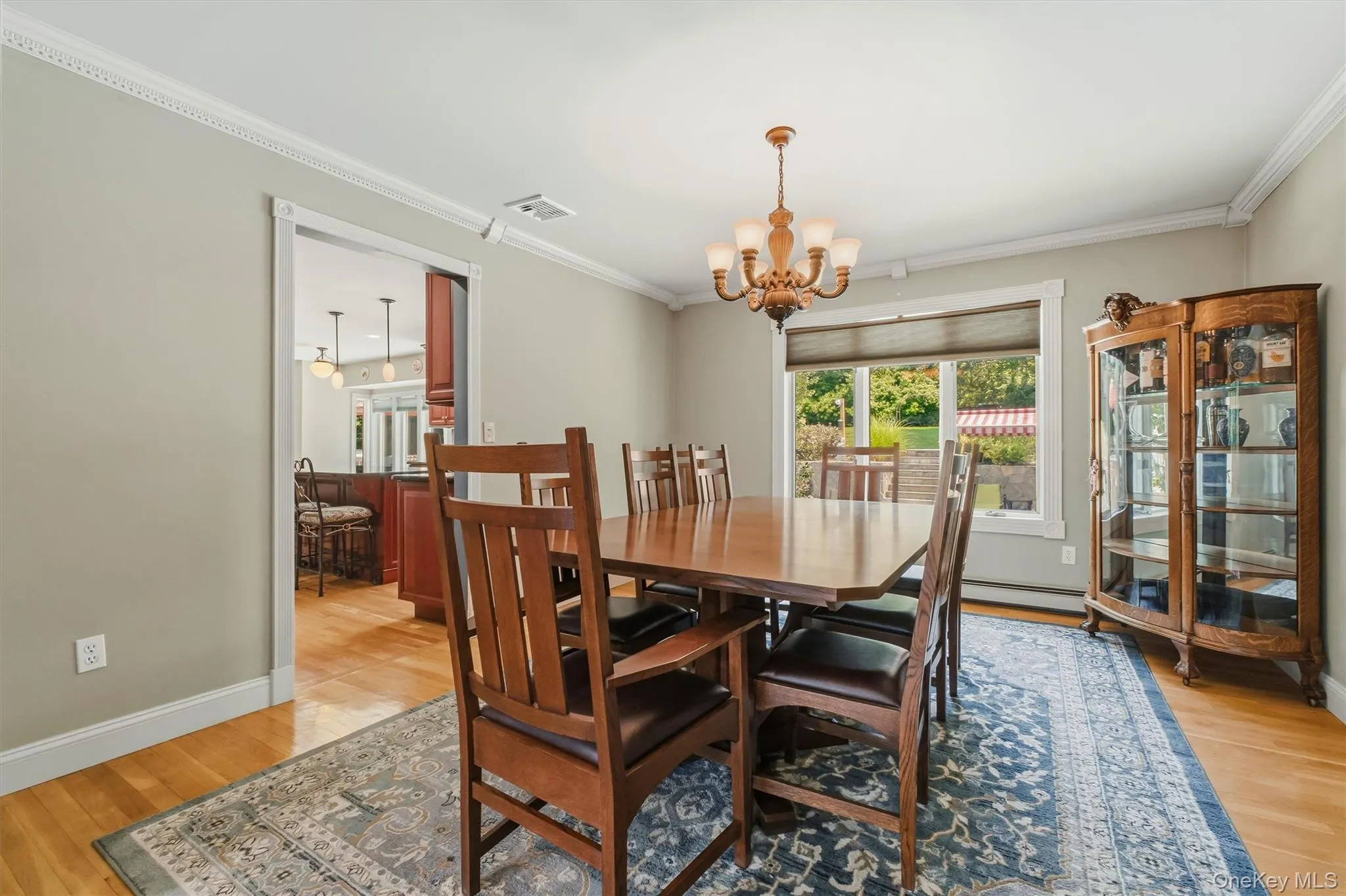 Formal dining room with enough space for a large dinner. Door on left leads to kitchen. Formal dining room with enough space for a large dinner. Door on left leads to kitchen.