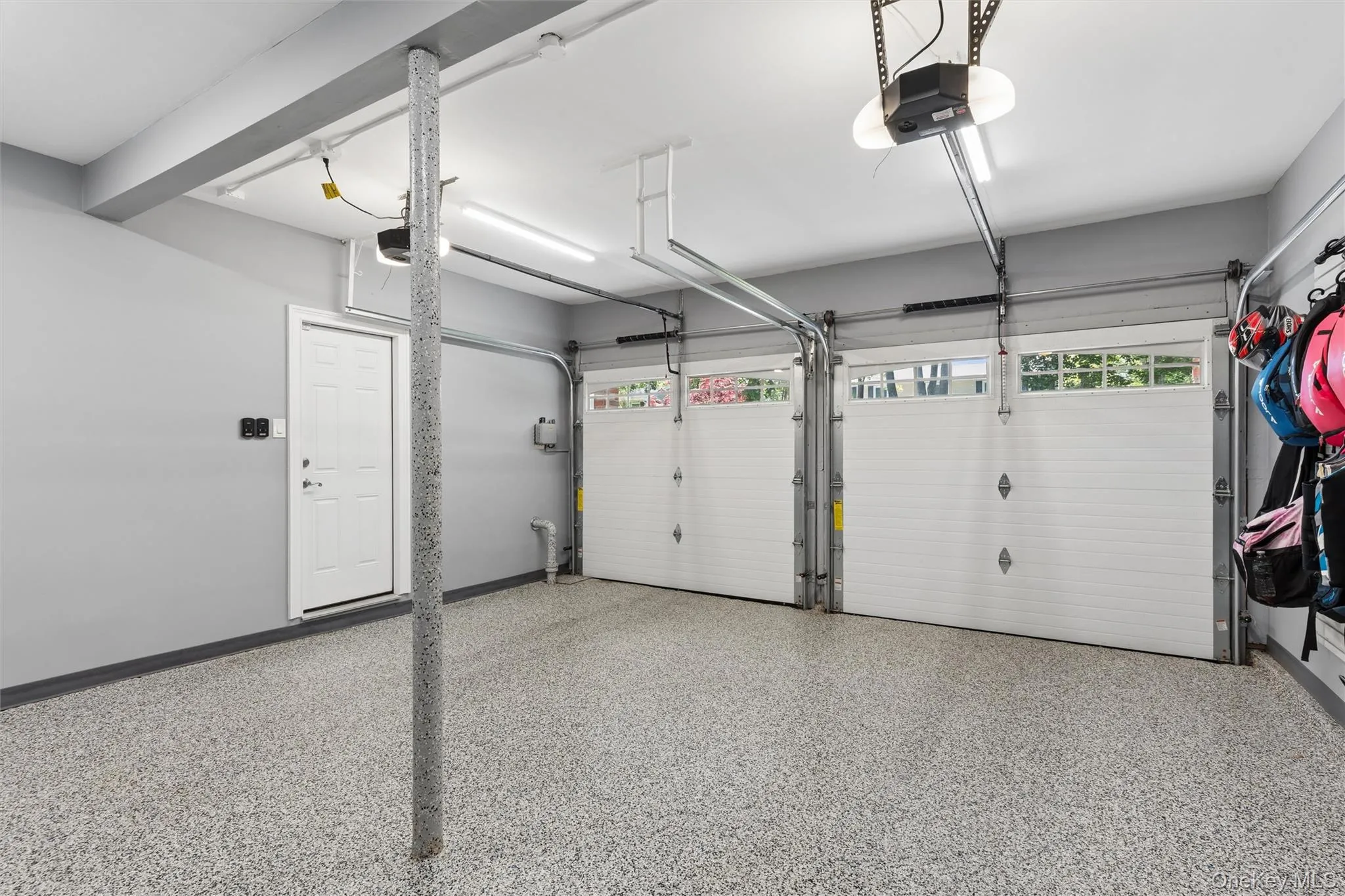 New garage doors, epoxy floors. New garage doors, epoxy floors.