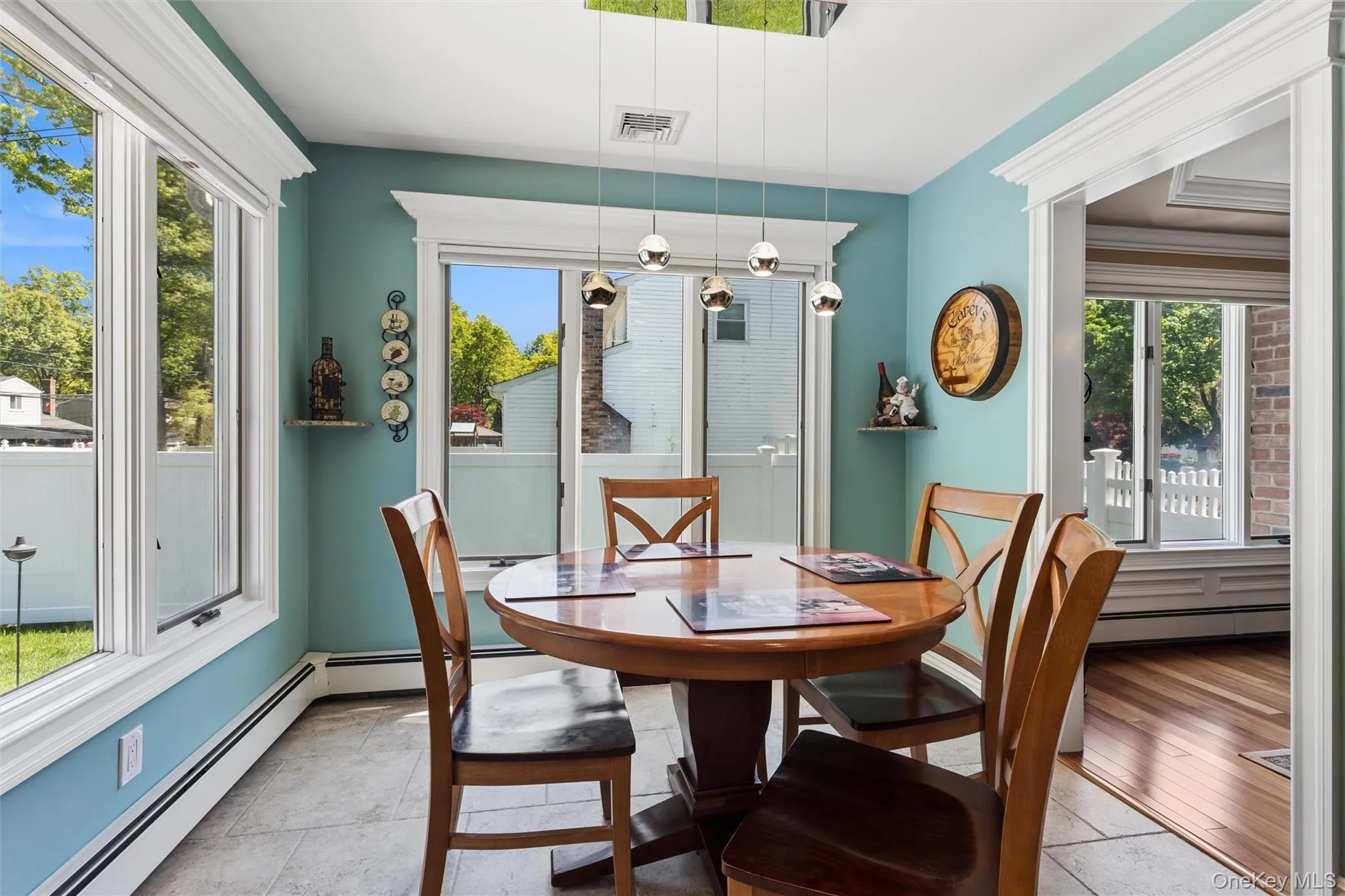 Kitchen eating area with Andersen windows and custom moldings. Kitchen eating area with Andersen windows and custom moldings.