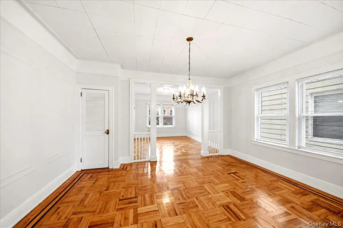 Open dining room with lots of sun, high ceilings and gleaming wood floors Open dining room with lots of sun, high ceilings and gleaming wood floors