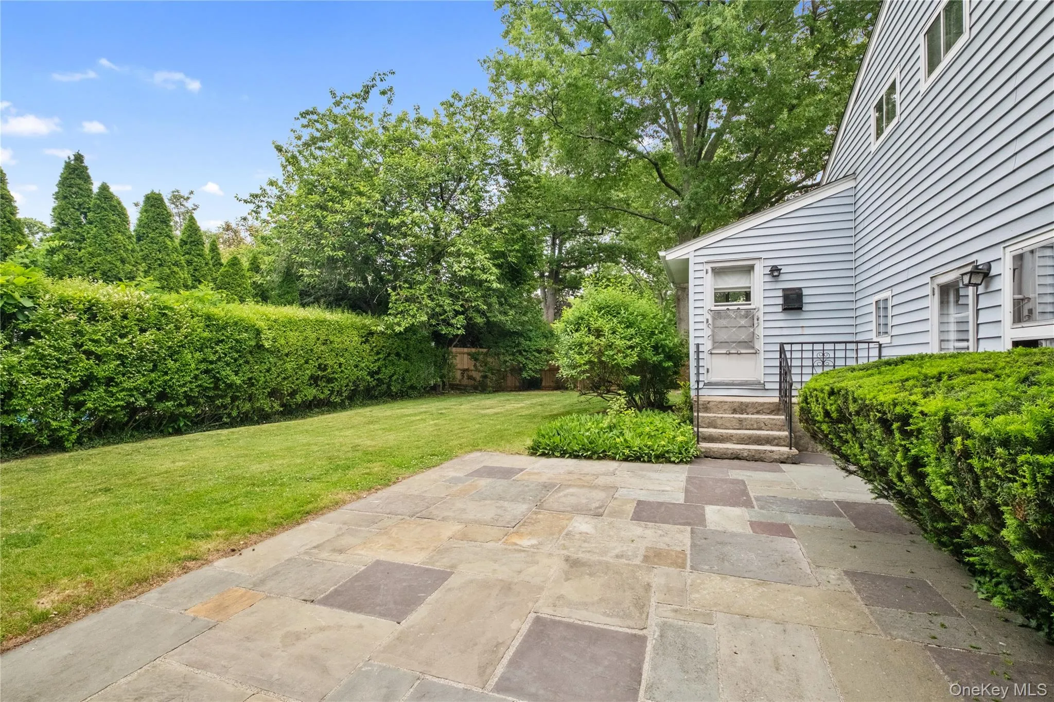Access patio and yard via kitchen door or family room door Access patio and yard via kitchen door or family room door
