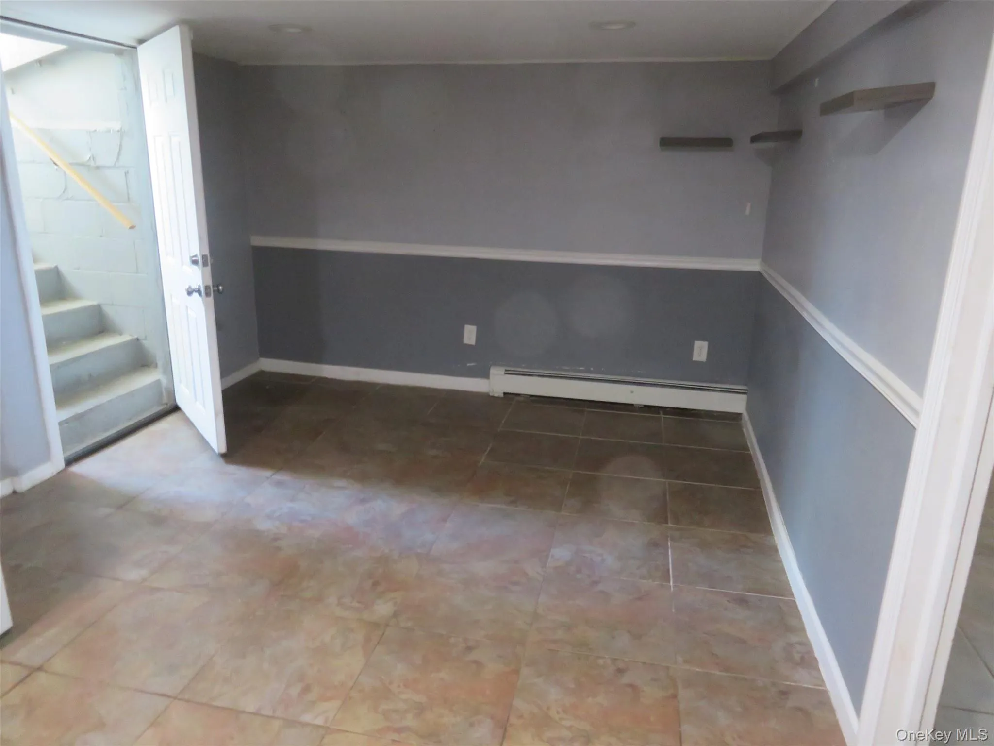 Neutral-toned tile flooring throughout Neutral-toned tile flooring throughout