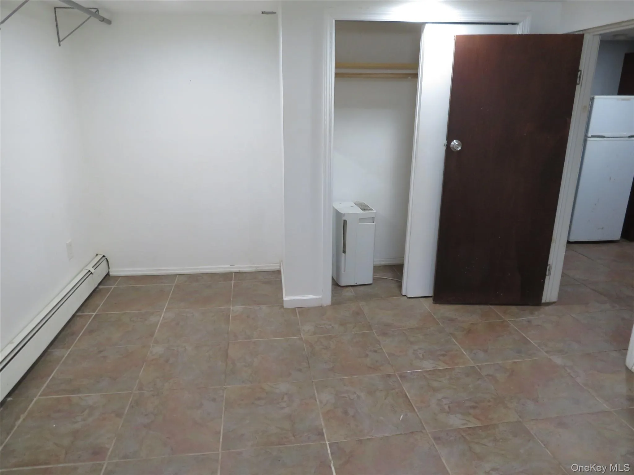 Neutral-toned tile flooring throughout Neutral-toned tile flooring throughout