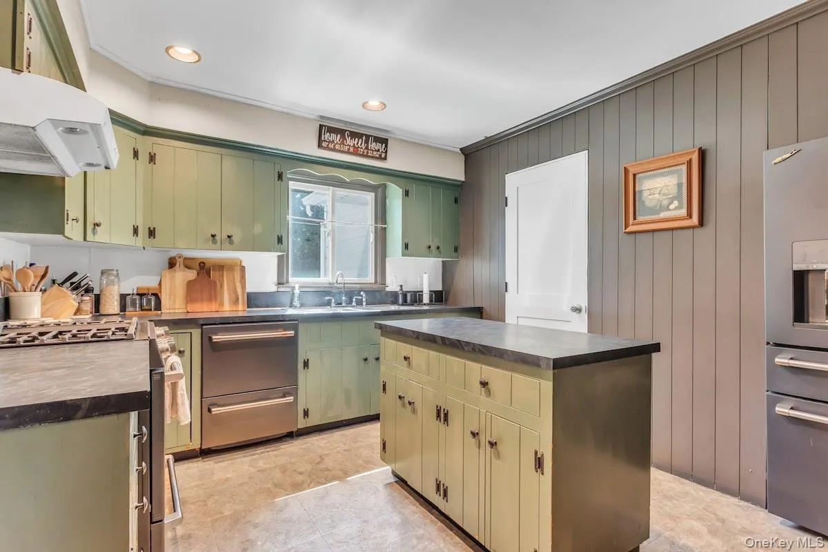 Stainless Appliances and Door leading to Slate Floor Family Room Stainless Appliances and Door leading to Slate Floor Family Room
