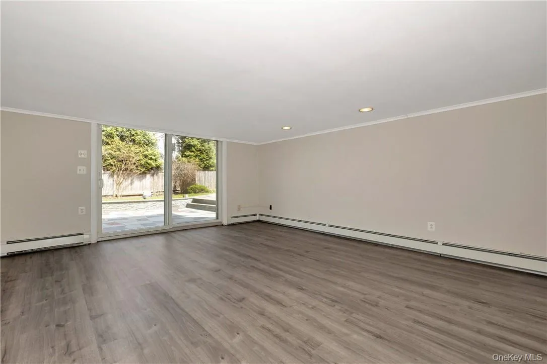 Lower Level Family Room with Doors out to Patio Lower Level Family Room with Doors out to Patio