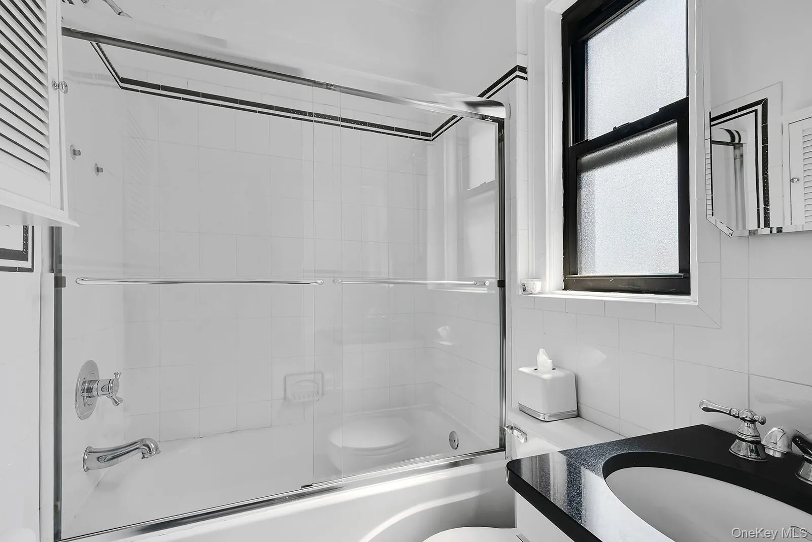 Bathroom featuring shower / bath combination Bathroom featuring shower / bath combination