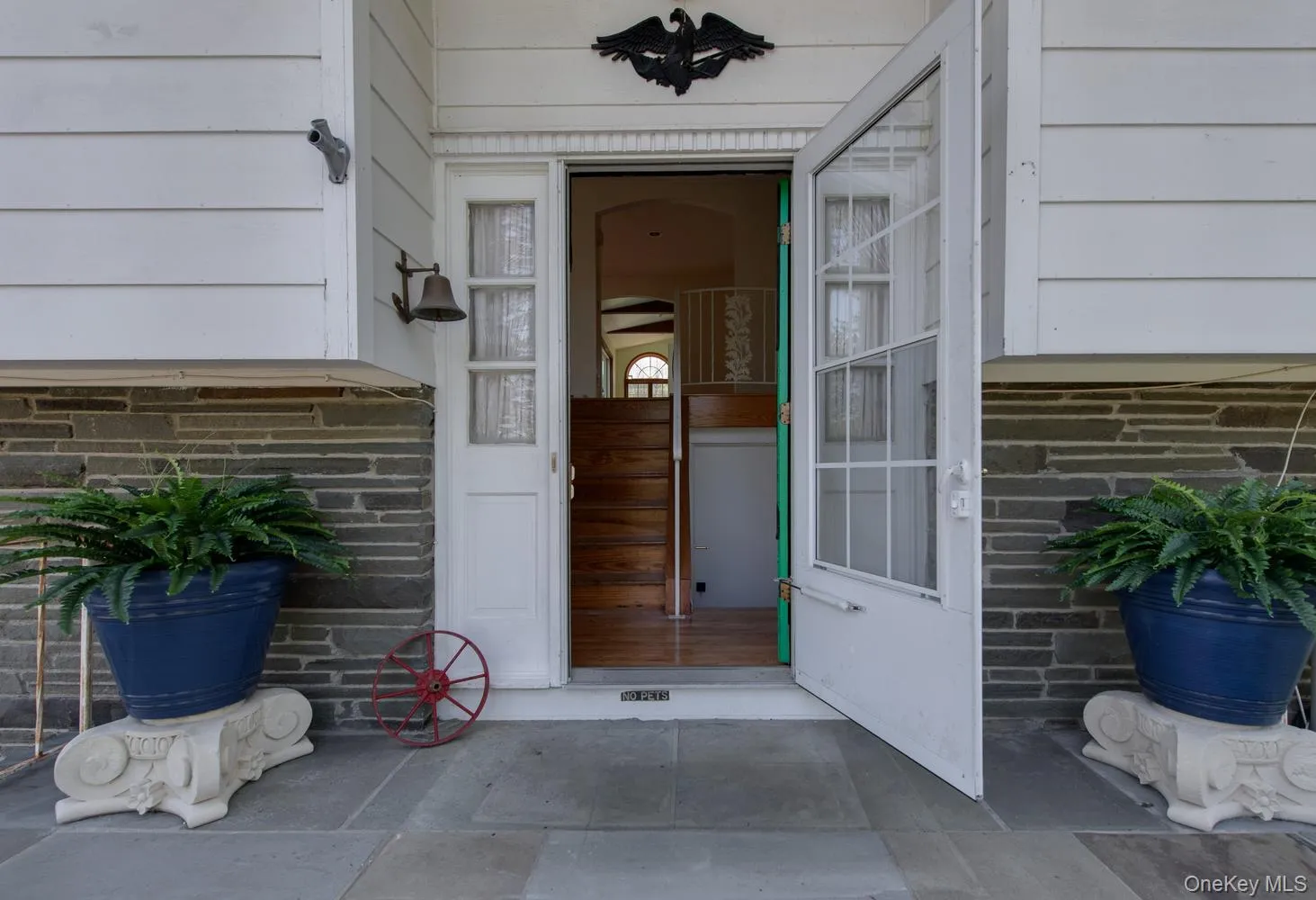 Welcoming entry featuring a stone paver porch Welcoming entry featuring a stone paver porch