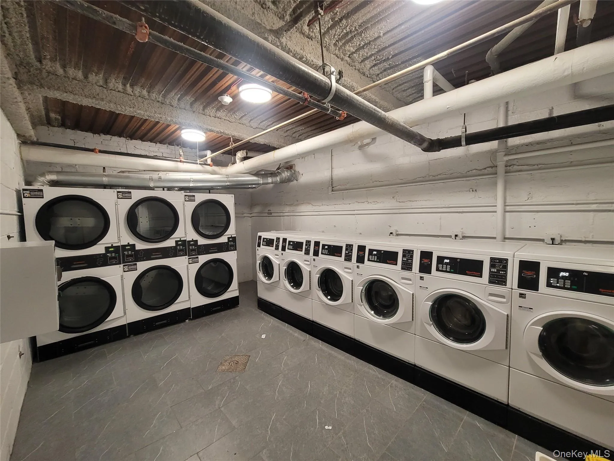 Dedicated laundry facility featuring multiple commercial-grade washers and dryers Dedicated laundry facility featuring multiple commercial-grade washers and dryers