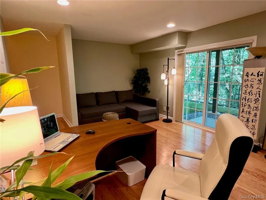 Family room with wood finished floors, recessed lighting, and baseboards Family room with wood finished floors, recessed lighting, and baseboards