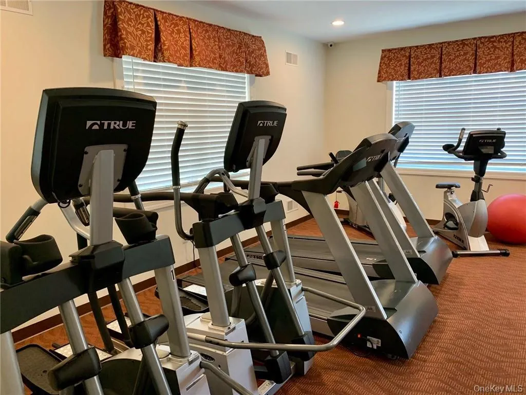 Exercise room featuring carpet floors and recessed lighting Exercise room featuring carpet floors and recessed lighting