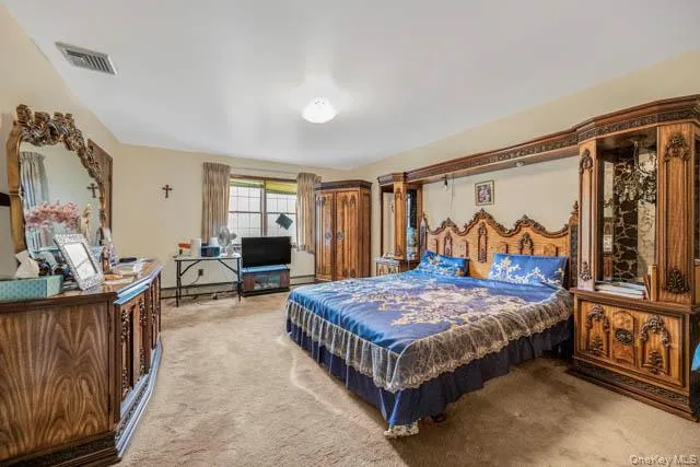 Carpeted bedroom with neutral wall tones Carpeted bedroom with neutral wall tones