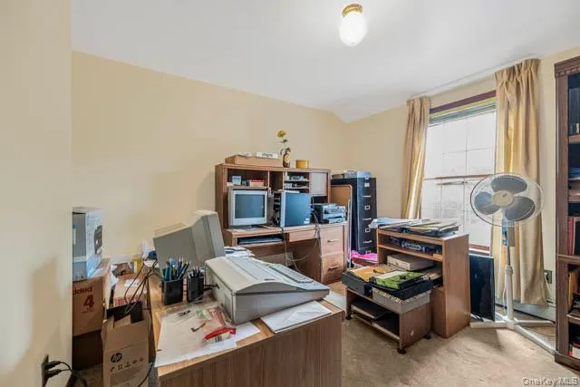 Room featuring a single window, wall-to-wall carpeting, and a ceiling-mounted light fixture Room featuring a single window, wall-to-wall carpeting, and a ceiling-mounted light fixture