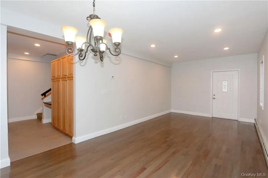 The living room opens to the kitchen. The living room opens to the kitchen.