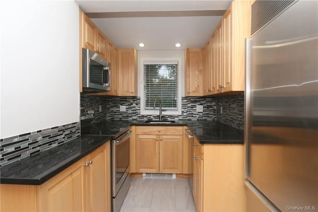 Stainless steel appliances include electric range, microwave, dishwasher and Sub-Zero refrigerator Stainless steel appliances include electric range, microwave, dishwasher and Sub-Zero refrigerator