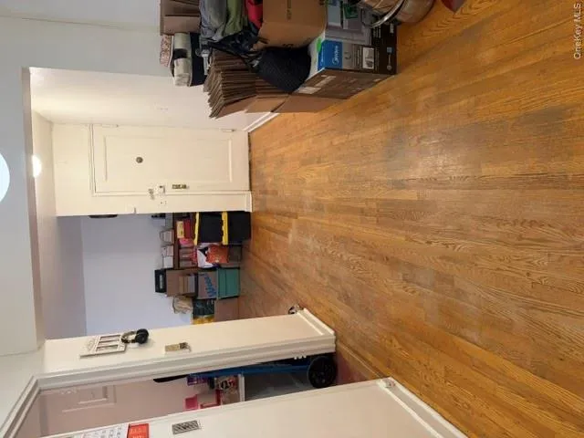 Hardwood flooring extending throughout the entryway and into the interior space Hardwood flooring extending throughout the entryway and into the interior space