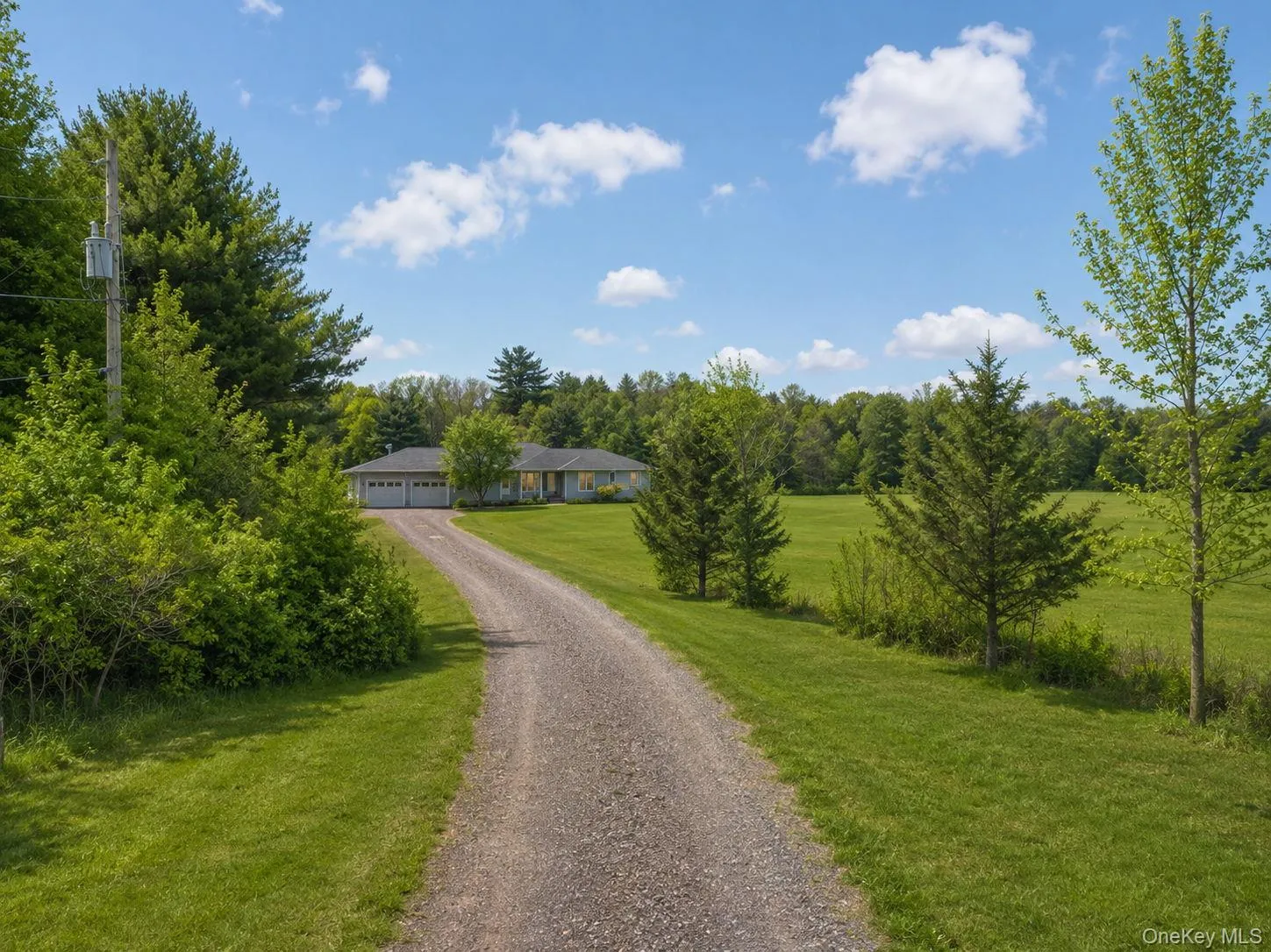 Property set on a spacious lot with expansive green lawn Property set on a spacious lot with expansive green lawn