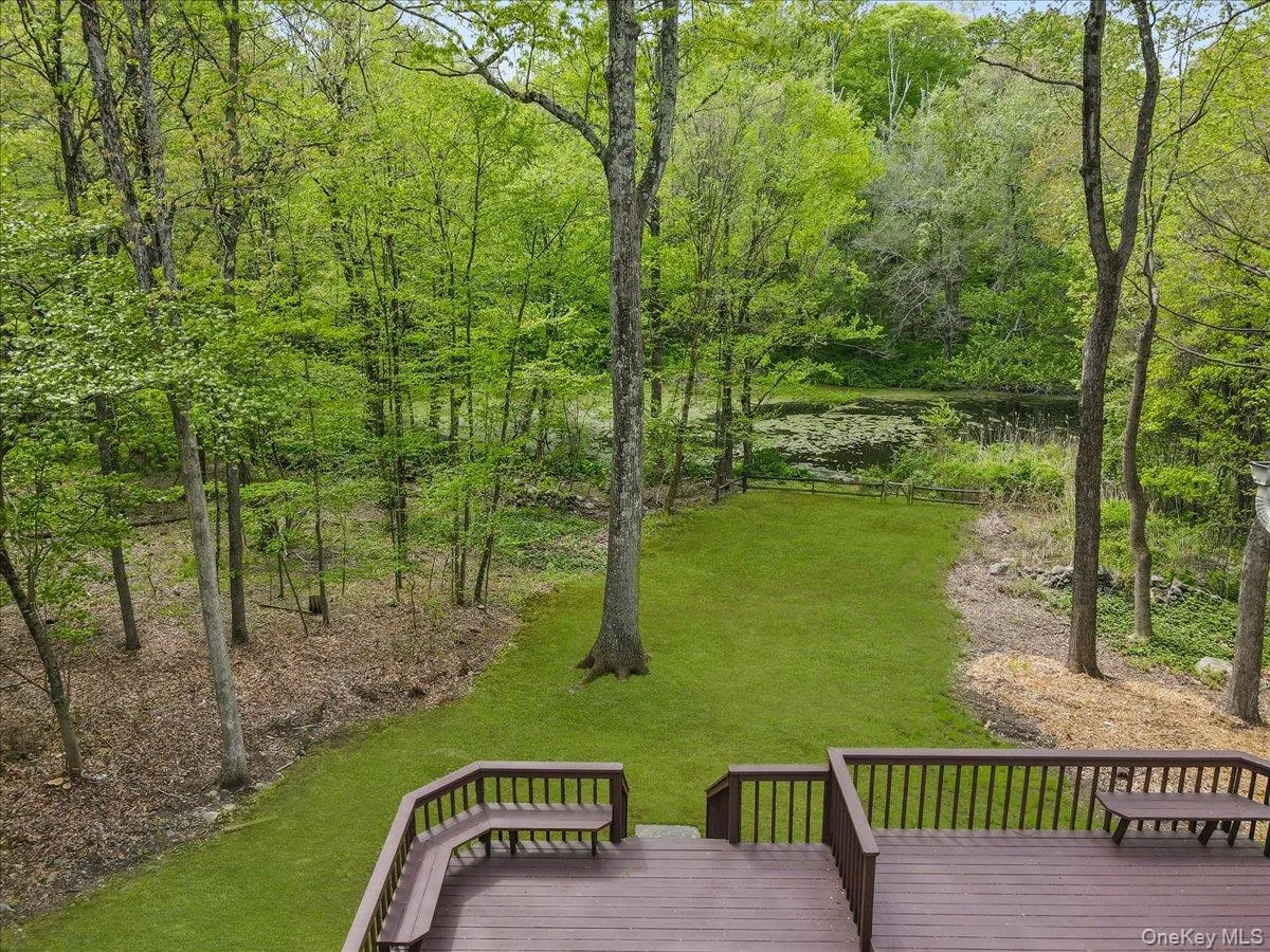 Backyard with room for outdoor living and activities; overlooks pond. Backyard with room for outdoor living and activities; overlooks pond.