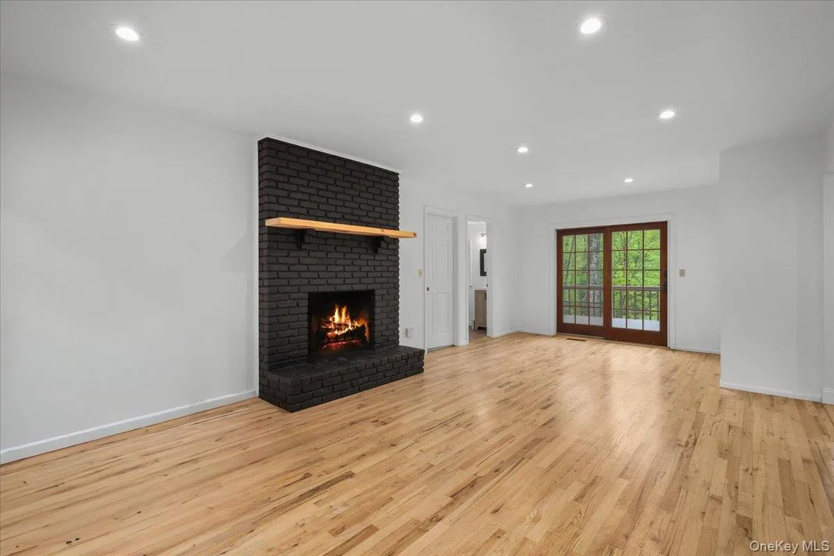 Brick Fireplace; access to deck. Brick Fireplace; access to deck.