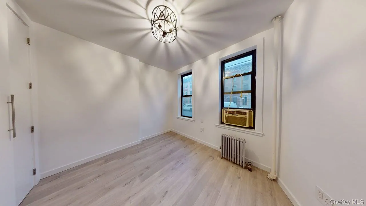 Light wood-finish flooring complements the neutral wall tones Light wood-finish flooring complements the neutral wall tones